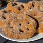 A plate of sugar coated spiced pumpkin bannock.