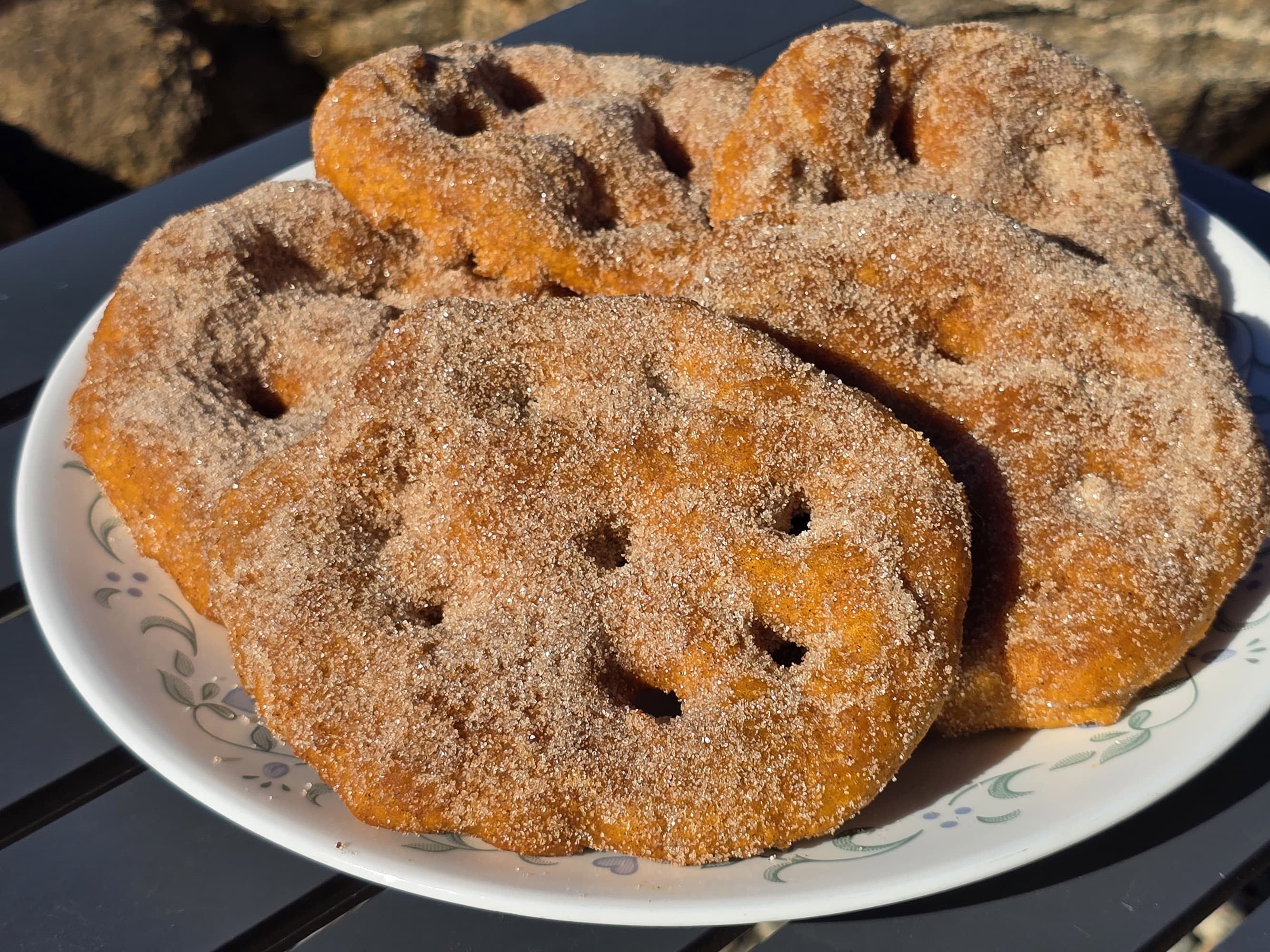 A plate of sugar coated spiced pumpkin bannock.