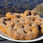 A plate of sugar coated spiced pumpkin frybread.